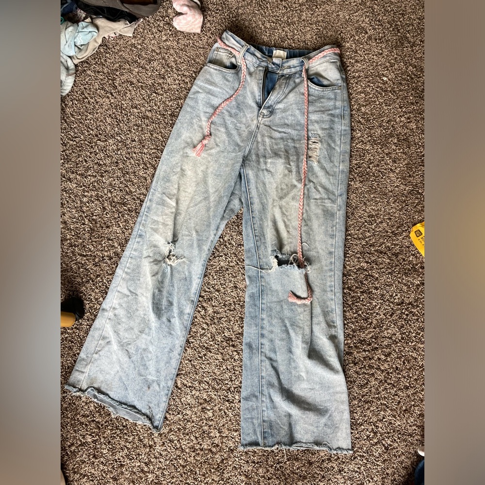 Size small light wash, straight leg, jeans with distressing and a braided belt